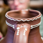 Doug Fitch and Hannah McAndrew making a jug for me